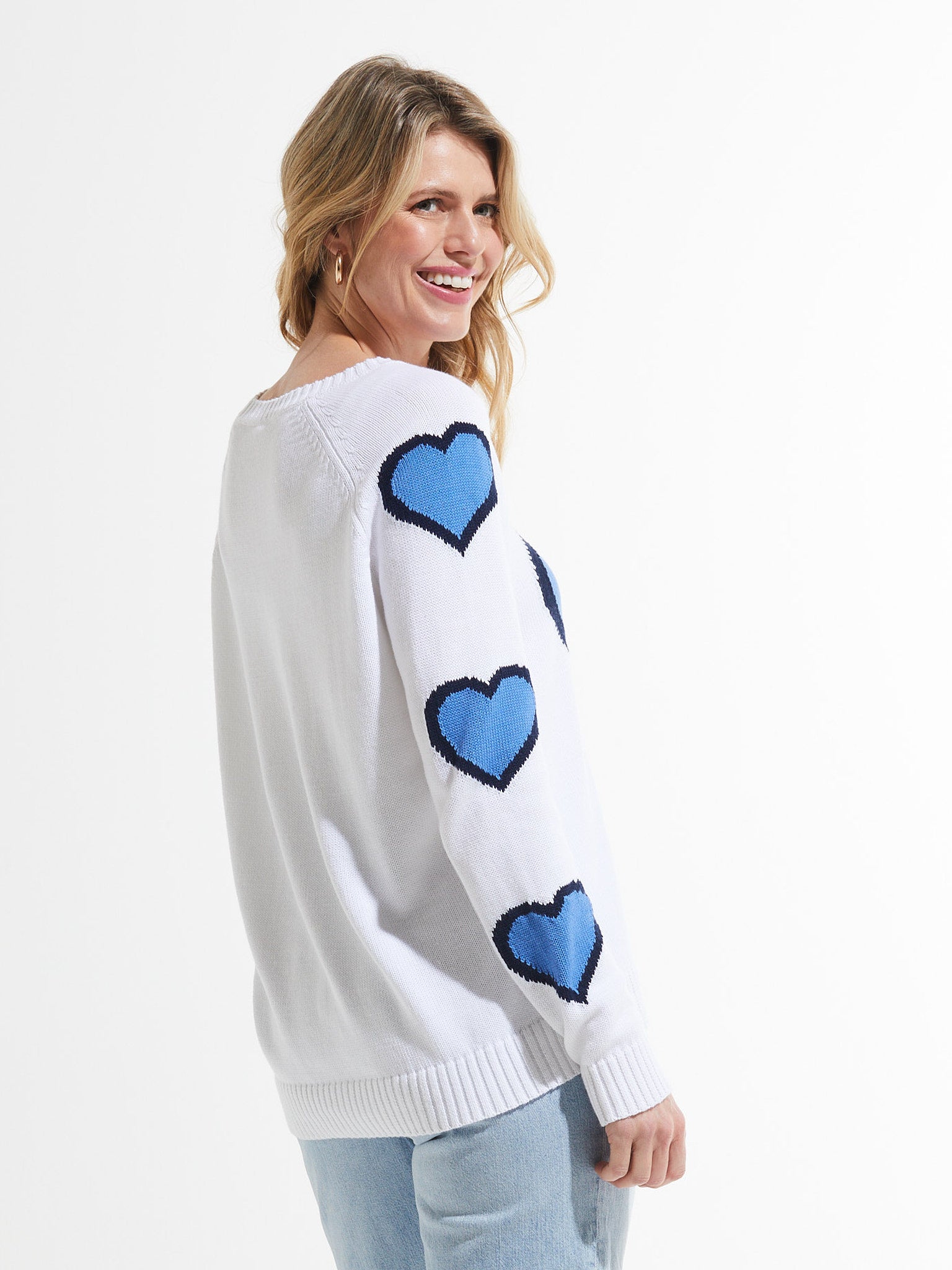 White sweater with heart patterns